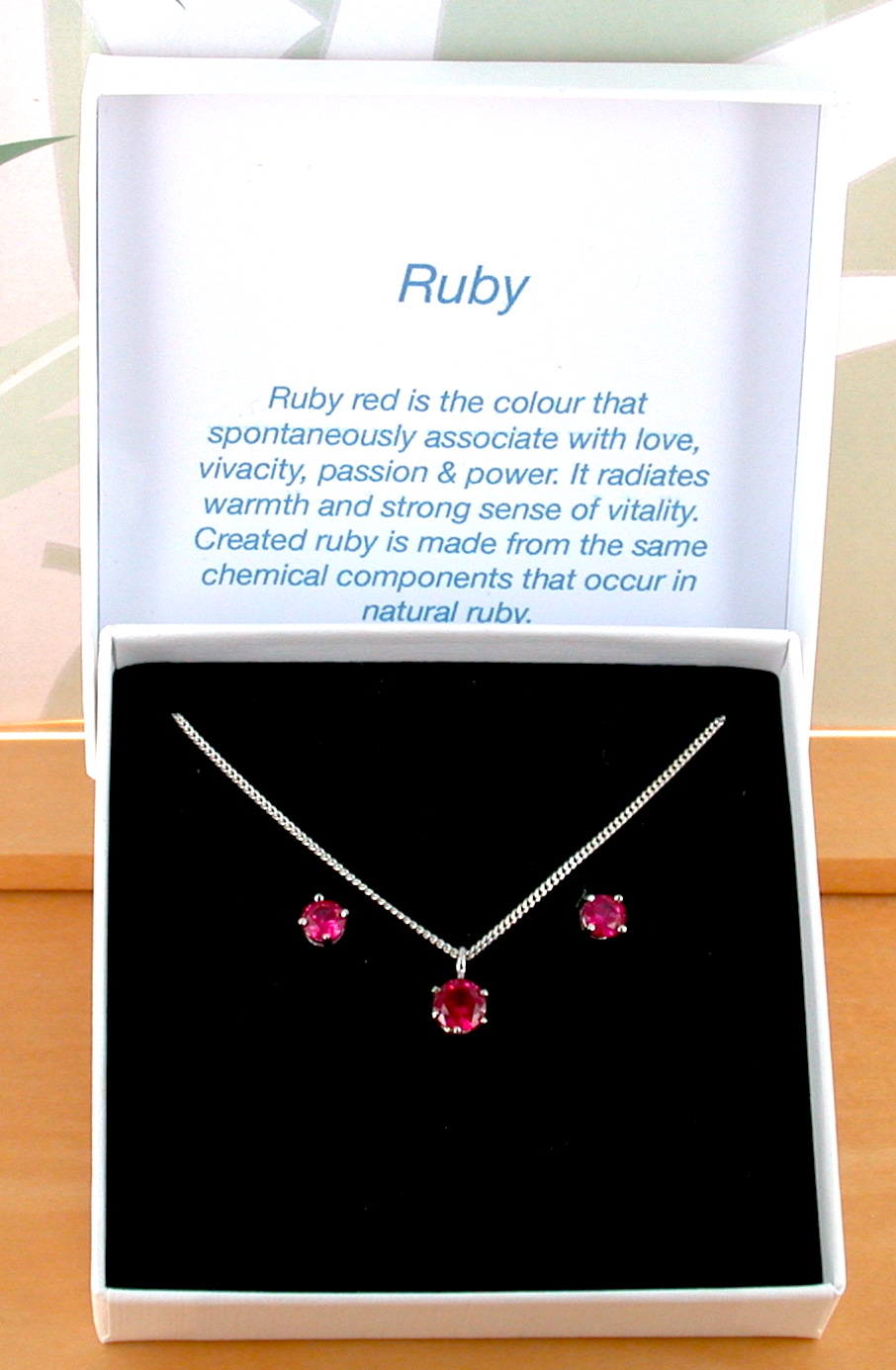 ruby solitaire necklace and earrings