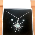 white opal sun necklace and earrings