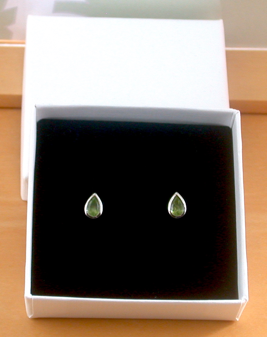 peridot stud earrings in a gift box