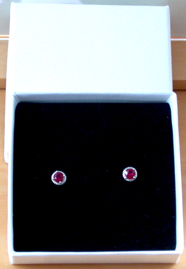 ruby stud earrings in a gift box