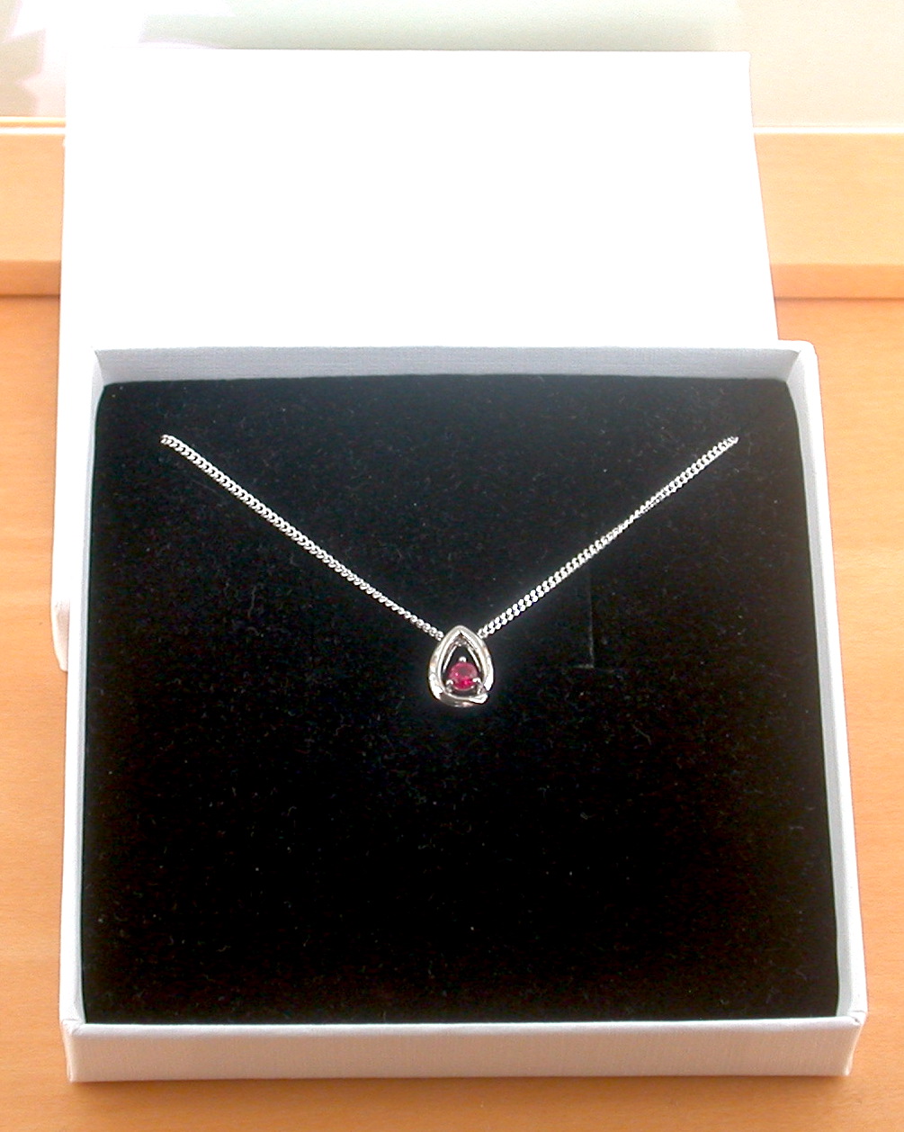 silver ruby necklace in a gift box